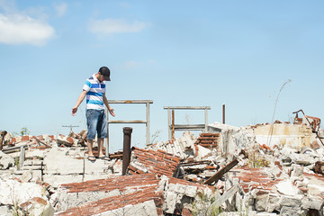 Man observing the destruction of his home.