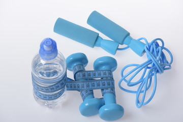 Naklejka premium Health and fitness symbols. Jump rope, water and barbells