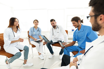 Fototapeta na wymiar doctors discuss an x-ray ,sitting in the office.