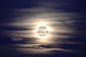 Naklejka na ściany i meble Full moon with cloudy sky.