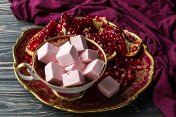 marshmelow and pomegranate on the table