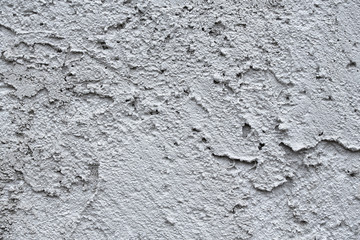 Facade plaster background. Single-ply monolithic plaster decorative background. Single layer scraped cement plaster wallpaper. Exterior building structure backdrop. Silica  sand Cement Wall Plaster.
