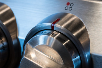 Stainless steel control knob on cooker