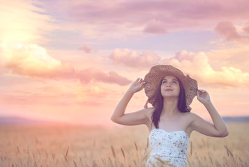 Woman in wheat field enjoying, freedom concept