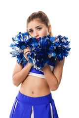 Young cheerleader in blue and white suit with pompoms on white background. Isolated on white background.