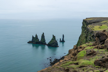 Rock formation Reynisdrangar and the high coast