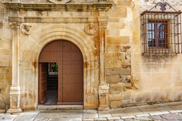 Old stone facade with wooden door