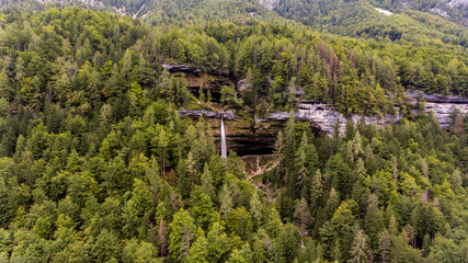 Fototapeta na wymiar Aerial view of double water fall in a forest.