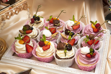 Obraz na płótnie Canvas festive table setting with a variety of desserts