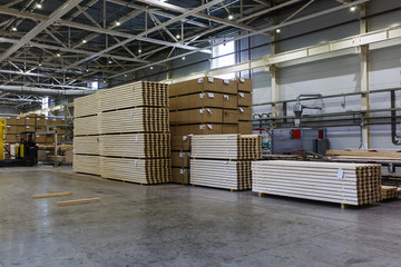 Modern production and storage room with lumber produced and ready for shipment. 