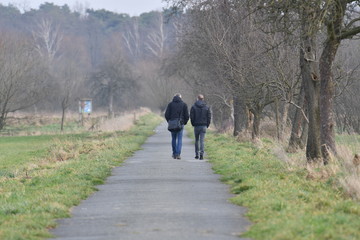 A young couple walking in a nature reserve in Muenster-Germany