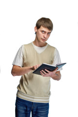 Handsome young businessman with a notepad and pen. Stylish attractive teacher. A nice man in fashionable casual clothes. The guy in the photo studio is preparing to write something down.