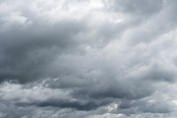 Dramatic cloudy sky. Rainy clouds flying over horizon.