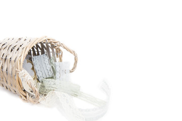 Cute and beautiful lace ribbons in basket on white background, isolated