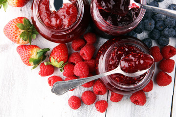 assortment of jams, seasonal berries, mint and fruits