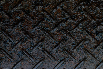 Wet rusty steel diamond plate texture for background