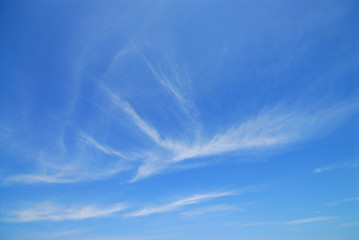 White fluffy clouds in blue sky.