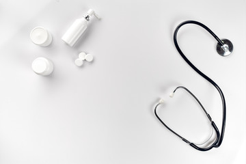 Stethoscope, pills, tablet on white background. Medicine concept