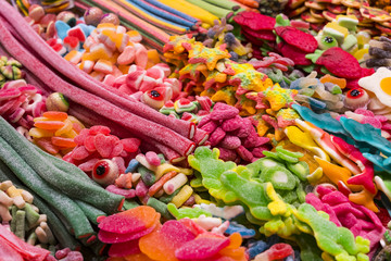 Assortment of jellied colored sweets as a product background