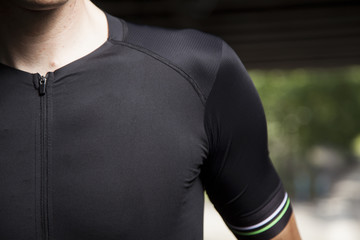 detail black cyclist shoulder in tunnel