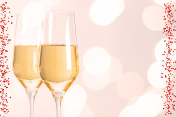 champagne glasses with hearts and Blurred background