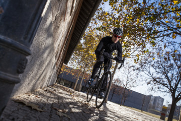 cyclist ride on the park with trees