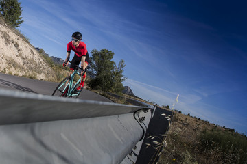 cyclist climbing the road