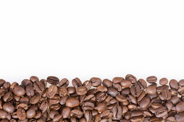 Roasted coffee beans on white background - Coffea