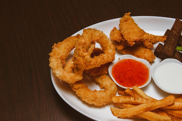 White plate with appetizers in a bar