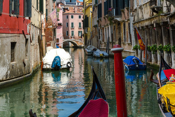 Fototapeta na wymiar VENICE, ITALY - on May 5, 2016. View on Grand Canal, Venetian Landscape with boats and gondolas