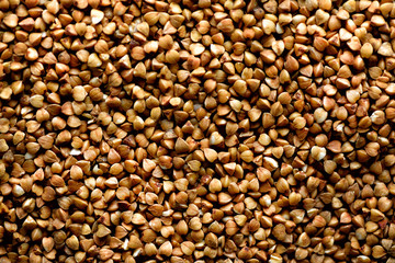 Roasted buckwheat texture. Food ingredient background. Top view, healthy lifestyle concept.