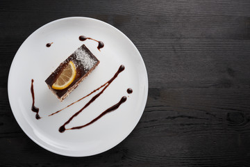  lemon chocolate cake on a plate with chocolate