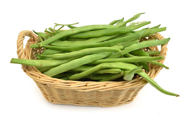 green beans in basket on white background