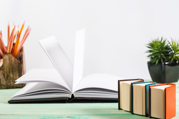 Pile of books on wooden background