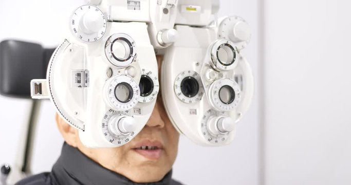Man doing the eye test in clinic