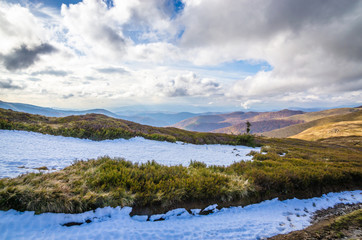 Autumn mountains in cloudly day