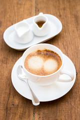 hot coffee on wooden table