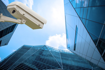 cctv camera with city building in background