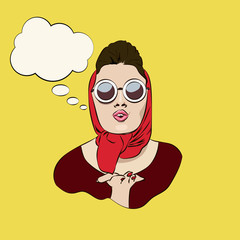Sexy retro glamourous girl in sunglasses and kerchief blowing a kiss with speechbubble