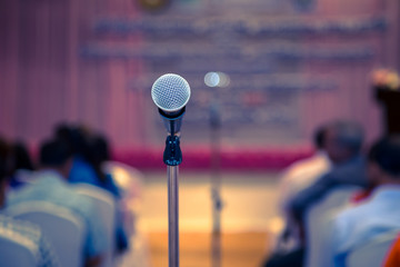 Microphone in the conference hall or seminar room background. meeting room, seminar, event,...