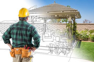 Contractor Standing Looking At Patio Pergola Design Drawing and Photo Combination. - obrazy, fototapety, plakaty