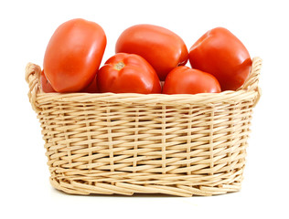 Tomatoes in a basket isolated on white background