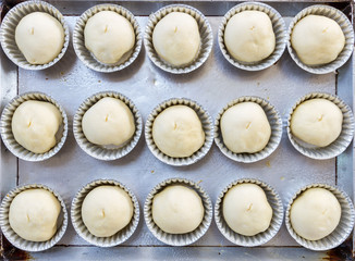Bakery top view fresh raw dough roll in tray