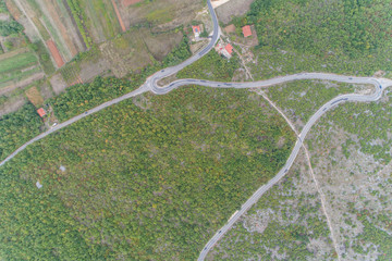 Aerial view on the green valley and the road in the mountains of Bosnia and Hercegovina. 
