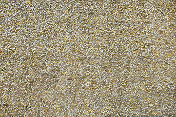 Old beige stone wall background texture