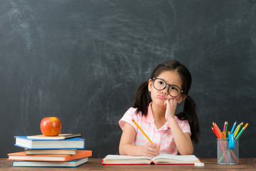 beautiful cute female children writing homework