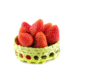 fresh strawberries in a bamboo basket