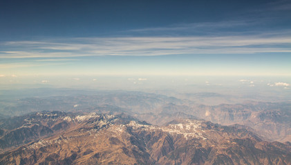 Fototapeta na wymiar View from plane window mountain With the morning sky