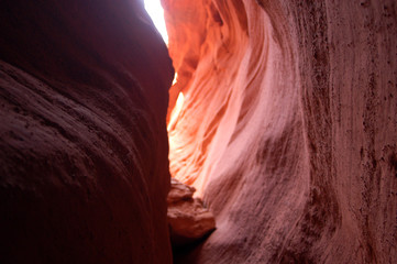 Red rock canyon lit by suns from above southern utah