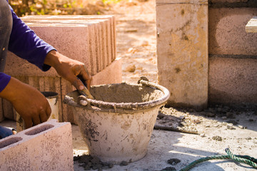 Technicians are working to build a brick wall